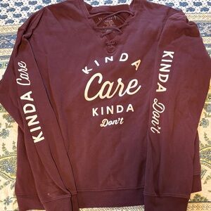 Wound Up Maroon V-Neck Sweater with Graphic Text